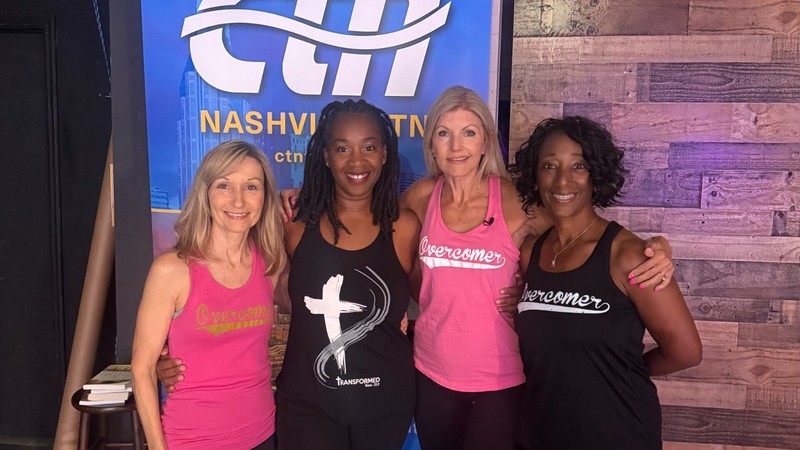 Angel leading a faith-centered fitness session with smiling participants